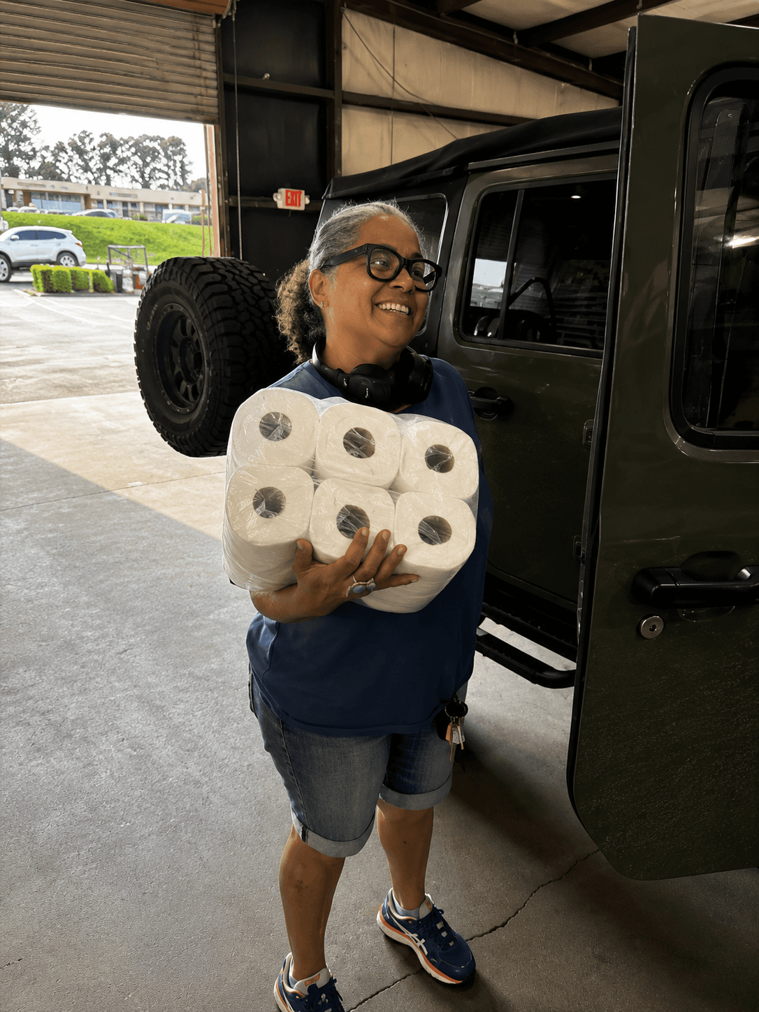 Customer receiving new tires at More Miles Tires